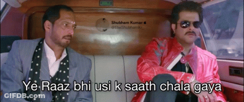 Two Men Are Sitting In A Car And One Of Them Is Wearing A Pink Jacket GIF