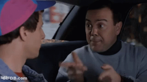 Two Men Are Sitting In A Car Talking To Each Other And One Of Them Is Wearing A Pink Hat . GIF