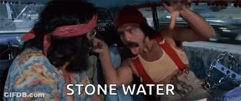 Two Men Are Sitting In A Car Talking To Each Other And The Words Stone Water Are Visible On The Screen . GIF