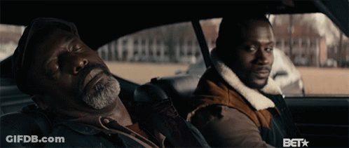Two Men Are Sitting In A Car With The Word Bet On The Bottom Right GIF