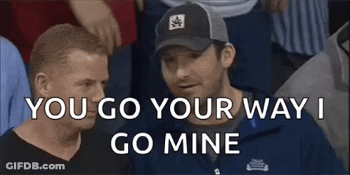Two Men Are Sitting In A Crowd And One Of Them Is Saying You Go Your Way I Go Mine GIF