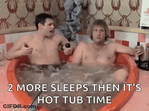 Two Men Are Sitting In A Hot Tub Holding Bottles Of Alcohol . GIF