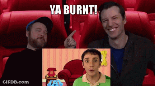 Two Men Are Sitting In A Movie Theater Watching A Blue's Clues Show GIF