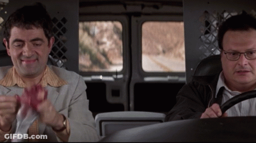 Two Men Are Sitting In A Van And One Has Glasses GIF
