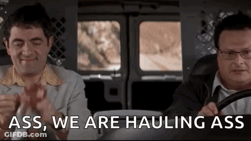 Two Men Are Sitting In A Van And One Of Them Is Saying `` Ass , We Are Haulng Ass '' . GIF