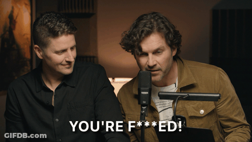 Two Men Are Sitting In Front Of A Microphone With The Words You 'Re F *** Ed GIF
