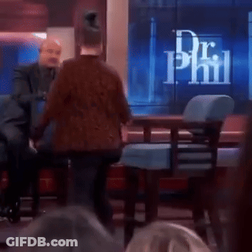 Two Men Are Sitting In Front Of A Screen That Says Dr Phil On It GIF