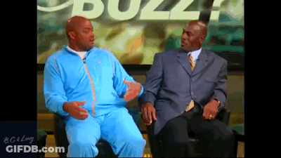 Two Men Are Sitting In Front Of A Screen With The Word Buzz On It GIF