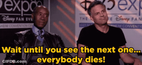 Two Men Are Sitting In Front Of A Sign That Says Disney Fan Event GIF