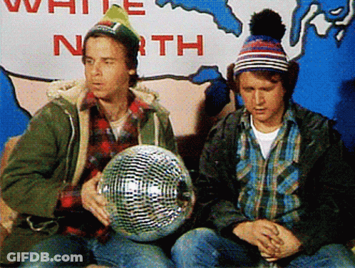 Two Men Are Sitting In Front Of A Sign That Says " White North " GIF