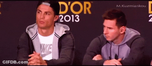 Two Men Are Sitting In Front Of A Wall That Says D' Or 2013 GIF