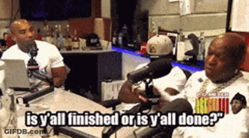 Two Men Are Sitting In Front Of Microphones And One Of Them Is Saying " Is Y All Finished Or Is Y All Done ? " GIF