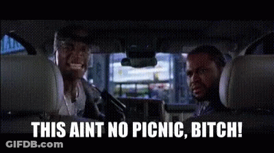 Two Men Are Sitting In The Back Seat Of A Car And Talking . GIF