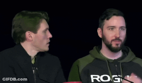 Two Men Are Sitting Next To Each Other And One Has A Hoodie That Says Rog On It GIF