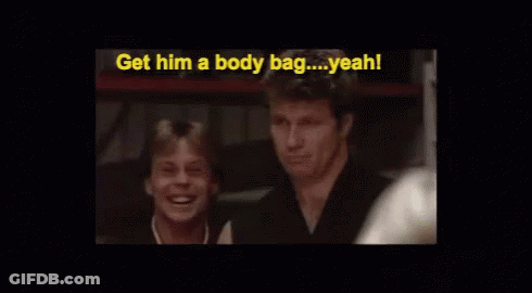 Two Men Are Sitting Next To Each Other And One Of Them Is Saying Get Him A Body Bag Yeah ! GIF