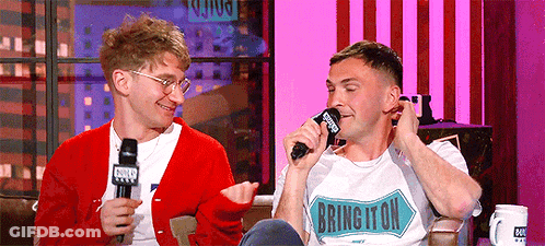 Two Men Are Sitting Next To Each Other And One Of Them Is Wearing A Shirt That Says Burlington GIF