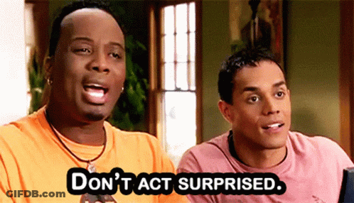 Two Men Are Sitting Next To Each Other And One Of Them Says " Don 'T Act Surprised " GIF