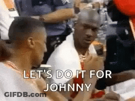Two Men Are Sitting Next To Each Other And Talking To Each Other . GIF