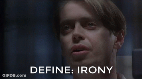 Two Men Are Sitting Next To Each Other And The Words Define Irony Are Visible GIF