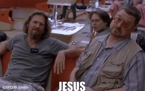 Two Men Are Sitting Next To Each Other In A Bowling Alley With The Word Jesus Written On The Screen . GIF