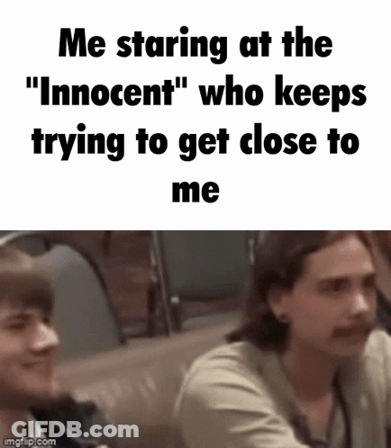Two Men Are Sitting Next To Each Other In A Car And One Of Them Is Trying To Get Close To The Other . GIF