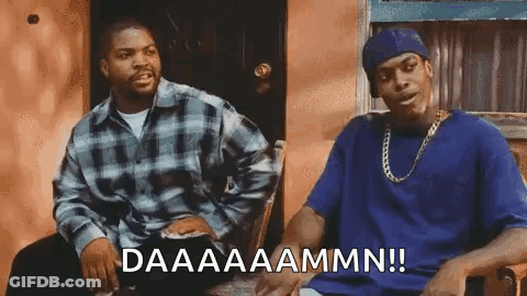 Two Men Are Sitting Next To Each Other In A Chair . GIF
