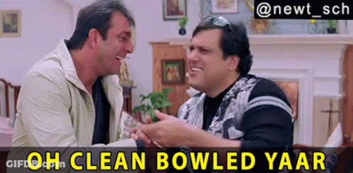 Two Men Are Sitting Next To Each Other In A Living Room With The Caption Oh Clean Bowled Yaar Above Them GIF