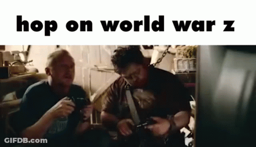 Two Men Are Sitting Next To Each Other In A Room Playing Video Games . GIF