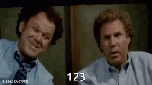 Two Men Are Sitting Next To Each Other In Front Of A Window And Smiling . One Of The Men Is Wearing A Tie . GIF