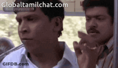 Two Men Are Sitting Next To Each Other On A Bus And One Of Them Is Pointing . GIF