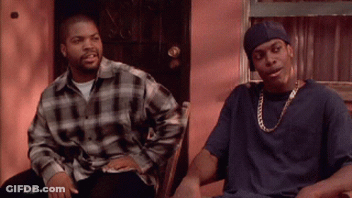 Two Men Are Sitting Next To Each Other On A Porch GIF