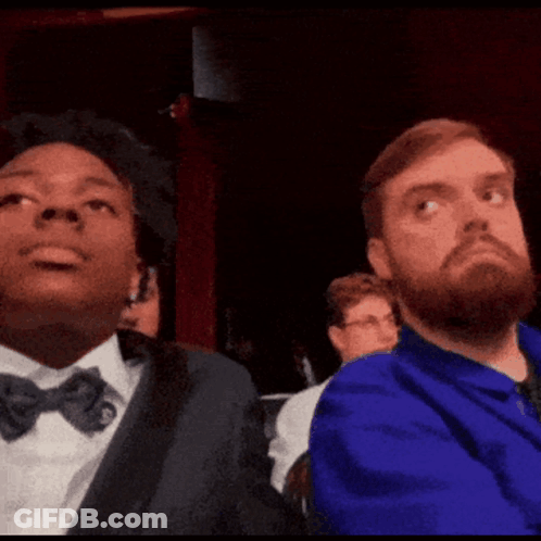 Two Men Are Sitting Next To Each Other With Ohio Stare Written On The Screen GIF