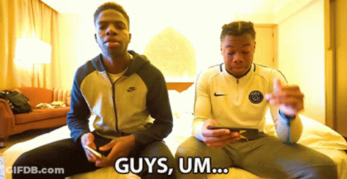 Two Men Are Sitting On A Bed And One Of Them Says " Guys Um ... " GIF