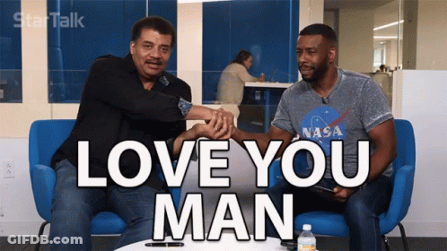 Two Men Are Sitting On A Blue Couch With The Words Love You Man On The Screen GIF