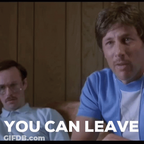 Two Men Are Sitting On A Couch And One Of Them Is Saying You Can Leave . GIF