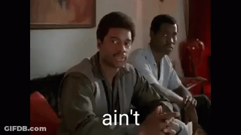 Two Men Are Sitting On A Couch And One Of Them Is Talking To The Other . GIF