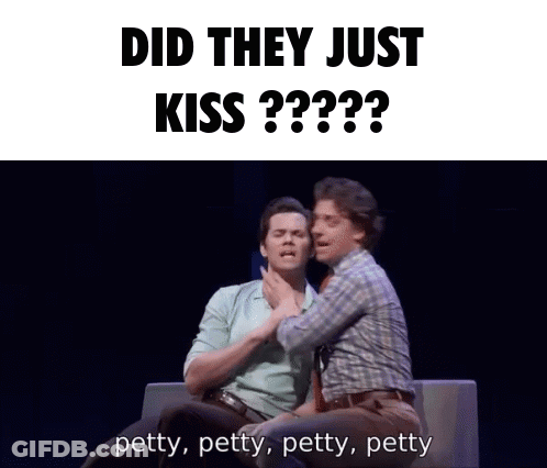 Two Men Are Sitting On A Couch With The Words Did They Just Kiss Behind Them GIF