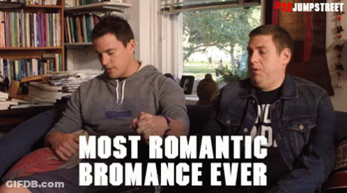 Two Men Are Sitting On A Couch With The Words Most Romantic Bromance Ever GIF