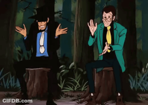 Two Men Are Sitting On A Tree Stump In A Forest . GIF