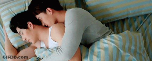 Two Men Sleeping On Striped Sheets Bed GIF