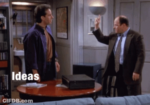 Two Men Are Standing Around A Table With The Words Ideas Written On The Bottom GIF