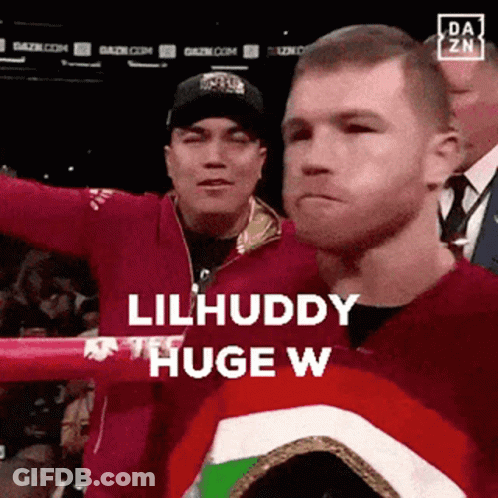 Two Men Are Standing In A Boxing Ring And One Of Them Is Saying Lilhuddy Huge W. GIF