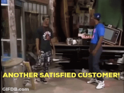 Two Men Are Standing In A Room With The Words " Another Satisfied Customer " In Yellow Letters GIF