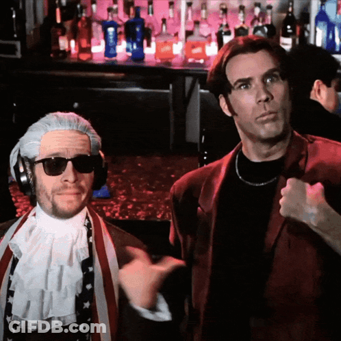 Two Men Are Standing In Front Of A Bar With Bottles Of Liquor GIF
