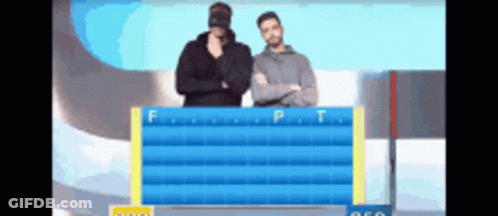 Two Men Are Standing In Front Of A Board With The Letters F And P On It GIF