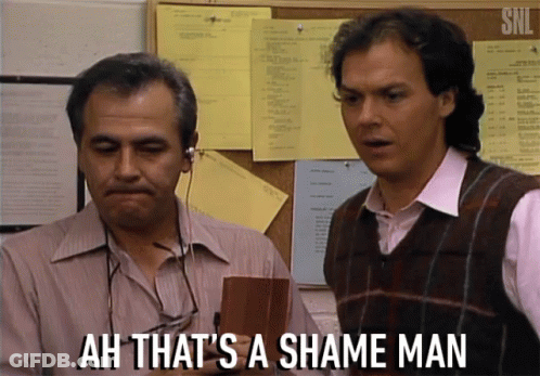 Two Men Are Standing In Front Of A Bulletin Board With The Words Ah That 'S A Shame Man GIF