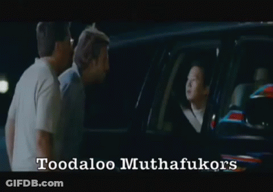 Two Men Are Standing In Front Of A Car With The Words Toodaloo Muthafukukors Written On The Bottom GIF