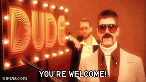Two Men Are Standing In Front Of A Dude Sign GIF