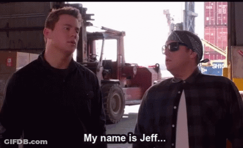 Two Men Are Standing In Front Of A Forklift And One Of Them Is Saying " My Name Is Jeff " GIF