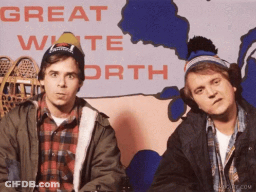 Two Men Are Standing In Front Of A Great White North Map GIF
